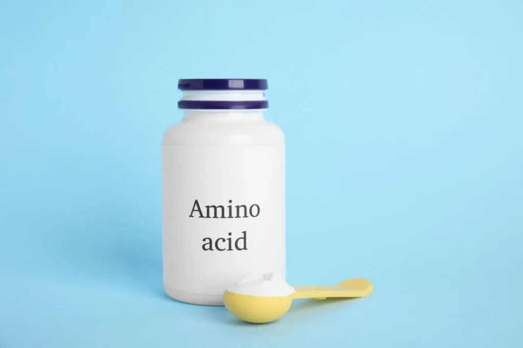 A bottle full of amino acid powder.