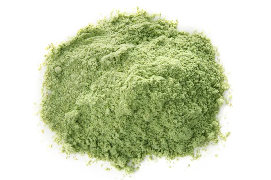 wheat grass powder on white background